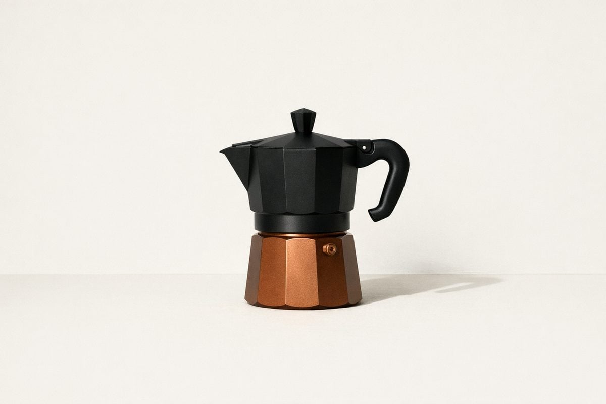 Minimal coffee gear on a warm neutral background. Soft morning light.