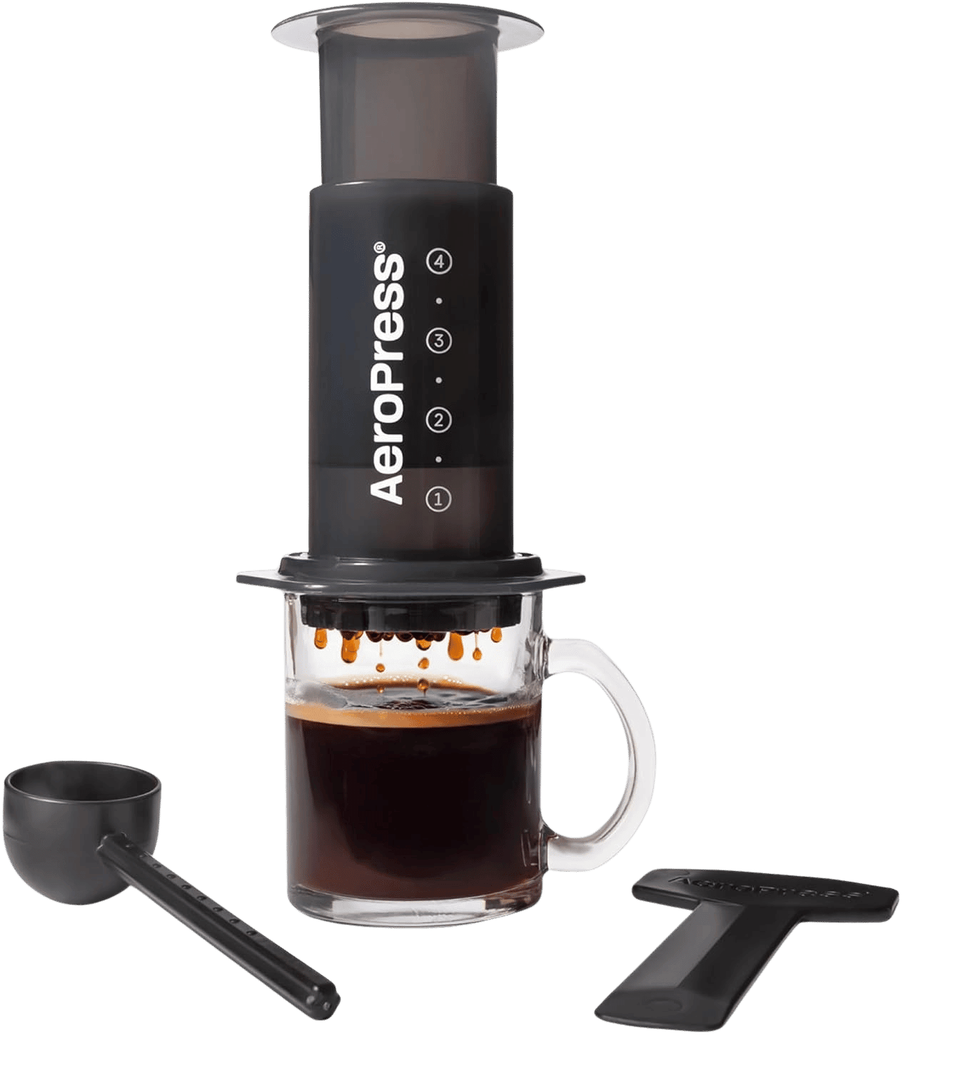 AeroPress Original on a glass mug with scoop and stirrer